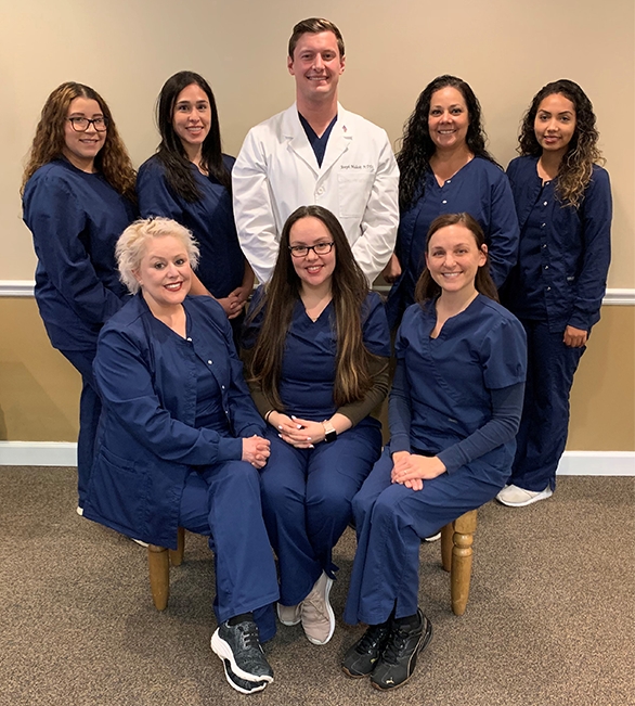 Smiling Aurora dentists and team at Sommers Family Dental